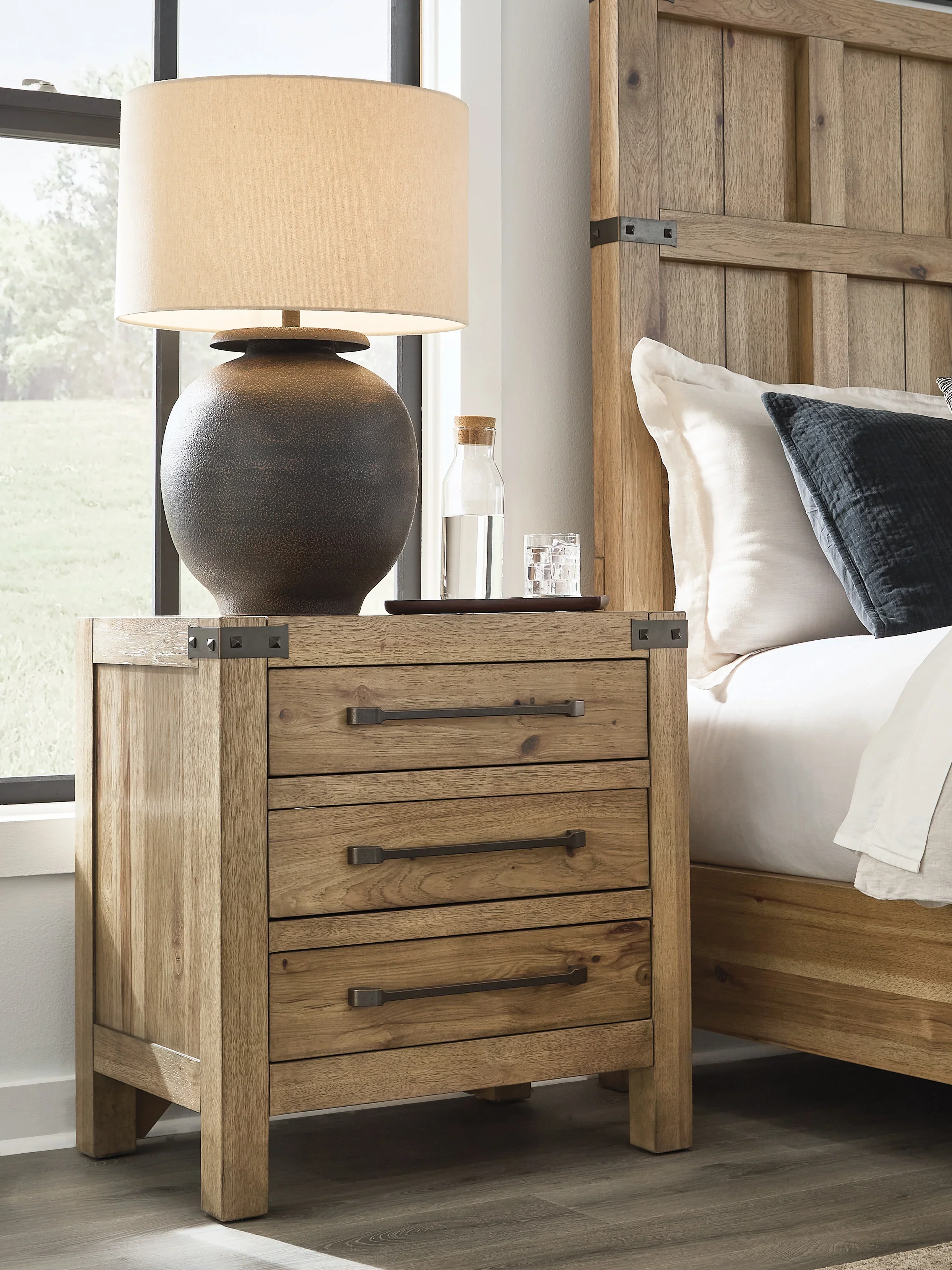 Ridgester Light Brown Three Drawer Nightstand